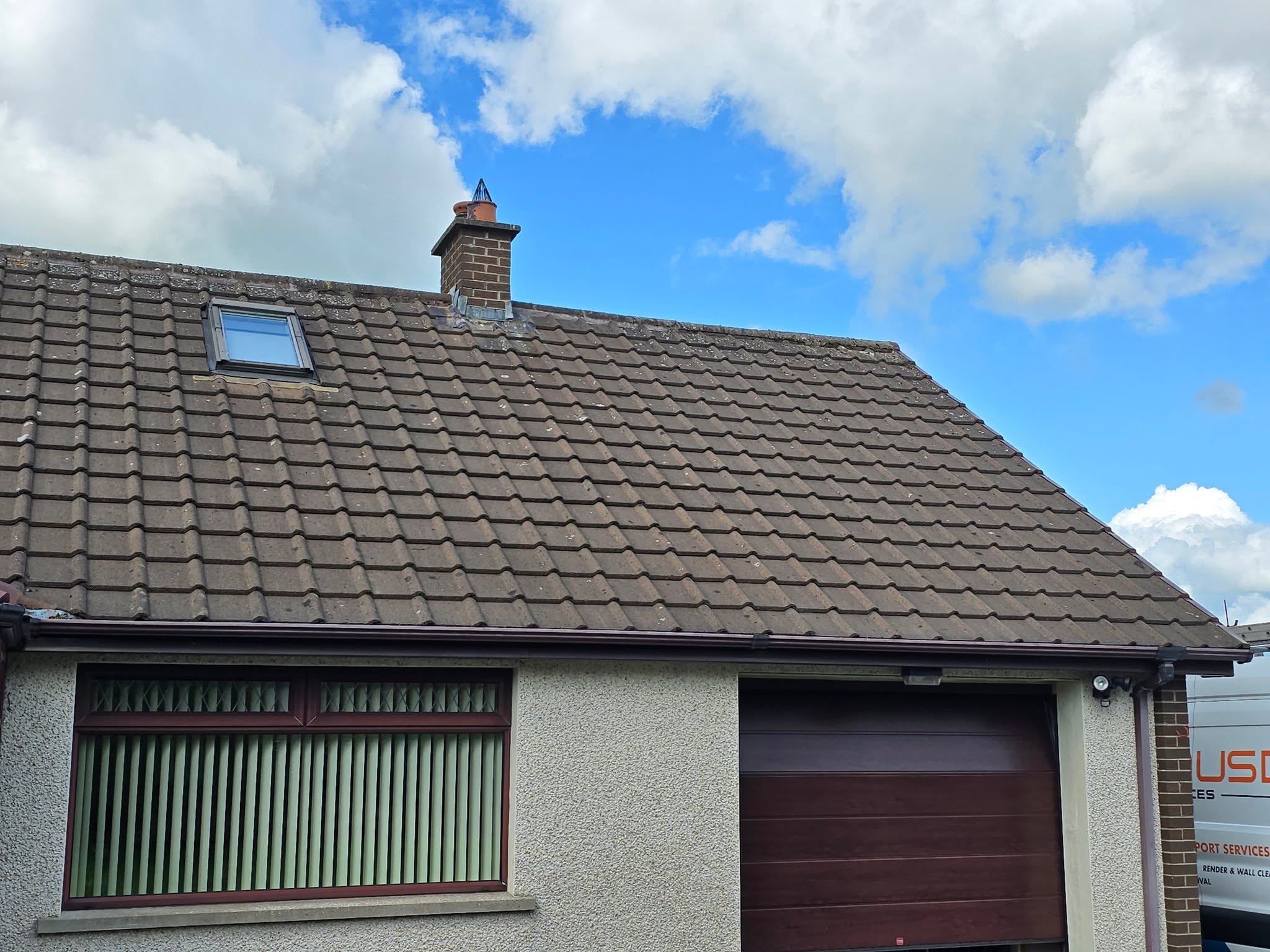 Clean roof tiles after professional moss removal and biocide treatment